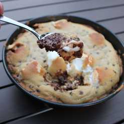 bite of giant s’mores stuffed chocolate chip skillet cookie