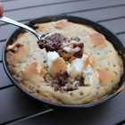 bite of giant s’mores stuffed chocolate chip skillet cookie