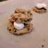 Thumb: s’mores stuffed cookie dough sandwiched around graham cracker pieces, chocolate pieces, and marshmallows
